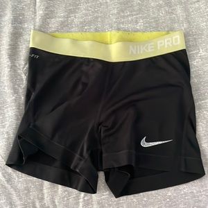 Yellow banded black Nike pro shorts
